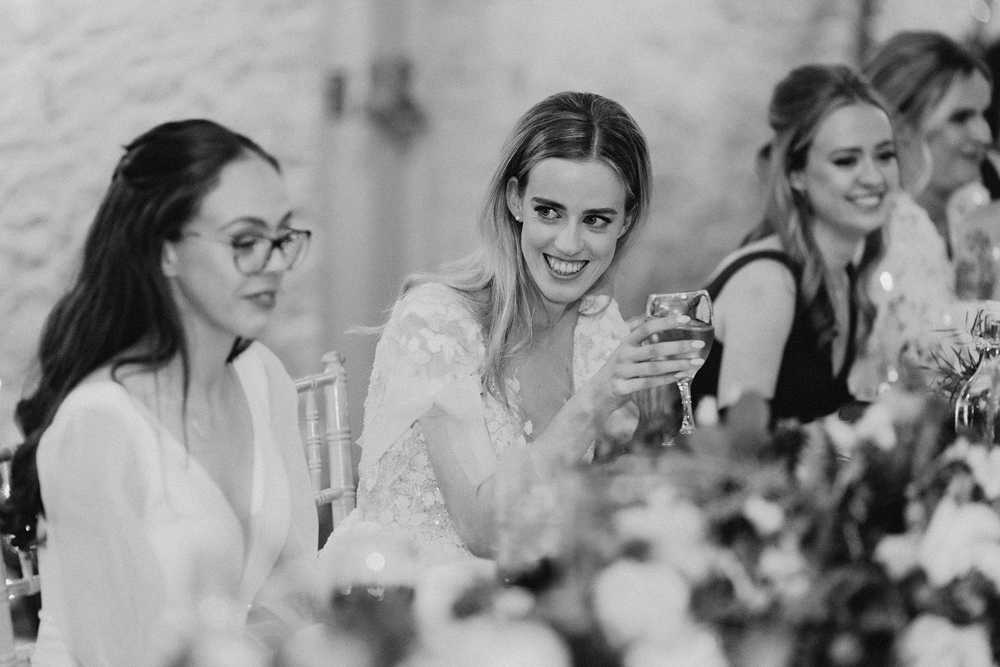 Bride at Top Table Larchfield Estate Co Down with glass of wedding wine