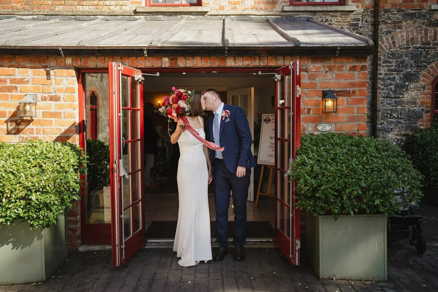 Just married Kiss outside the Stables post Ceremony at Larchfield Estate Heritage Wedding Venue Ireland