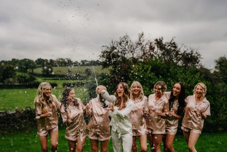 Bride and Bridesmaids celebrating at Larchfield Estate Top Wedding Venue LIT photography